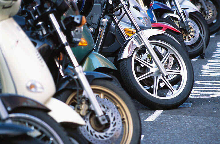 Row of Motorcycles Front Wheels
